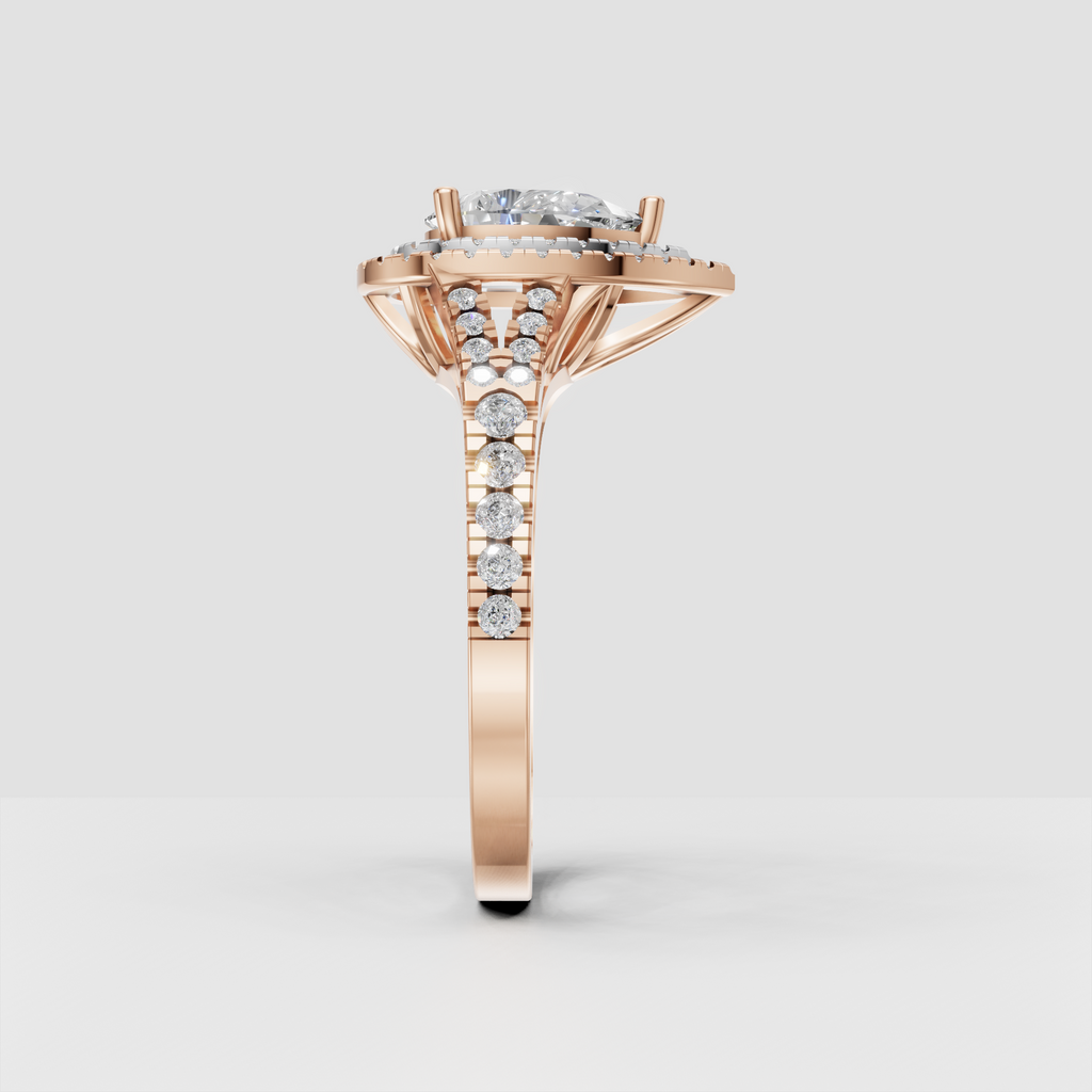 Detailed pear Diamond halo ring with polished yellow gold setting and pavé shank