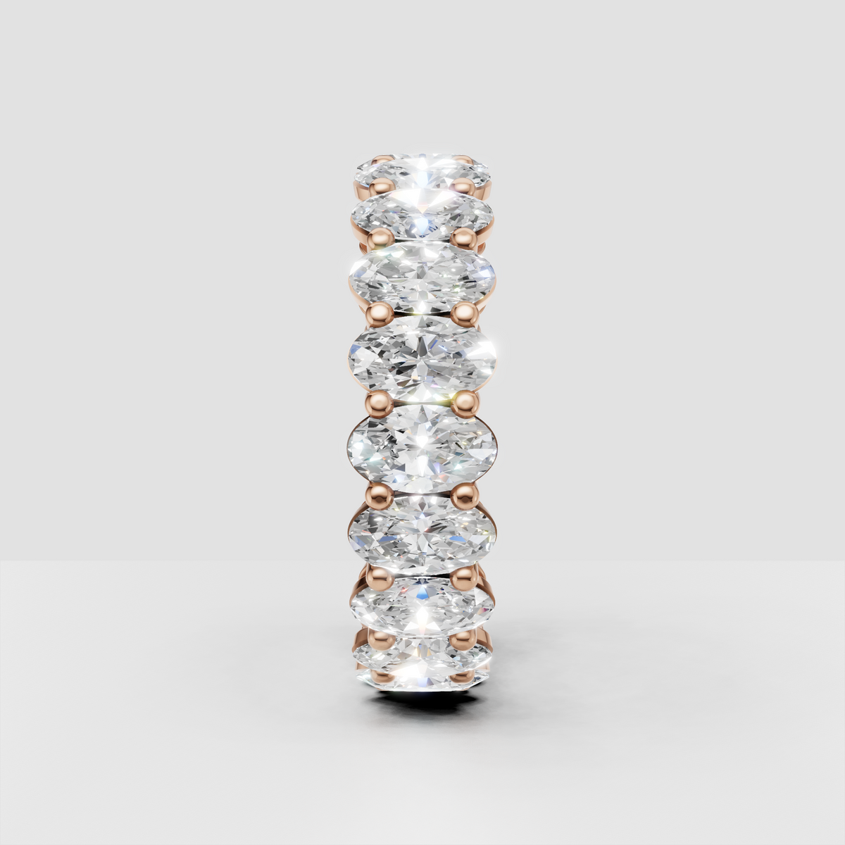 Sophisticated oval diamond eternity ring side perspective