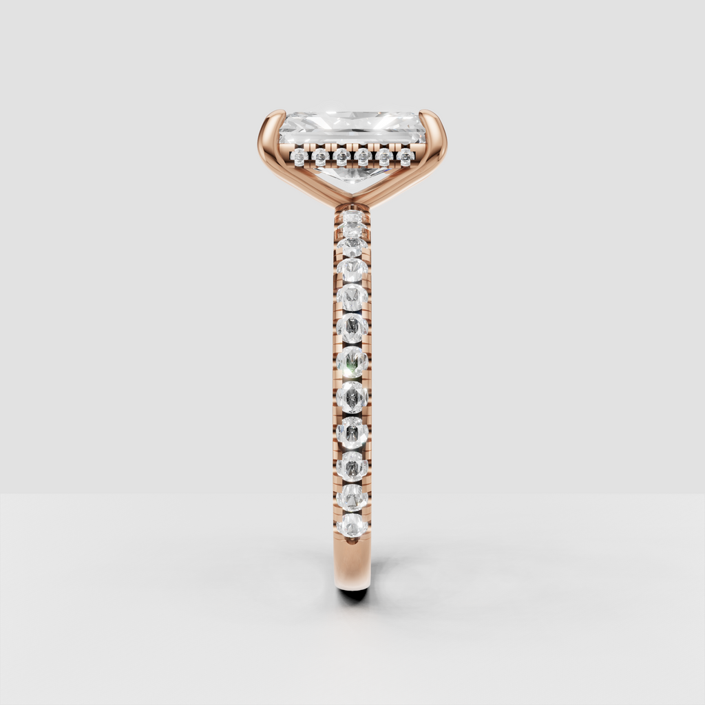 Elongated radiant cut canter diamond in four-prong solitaire setting