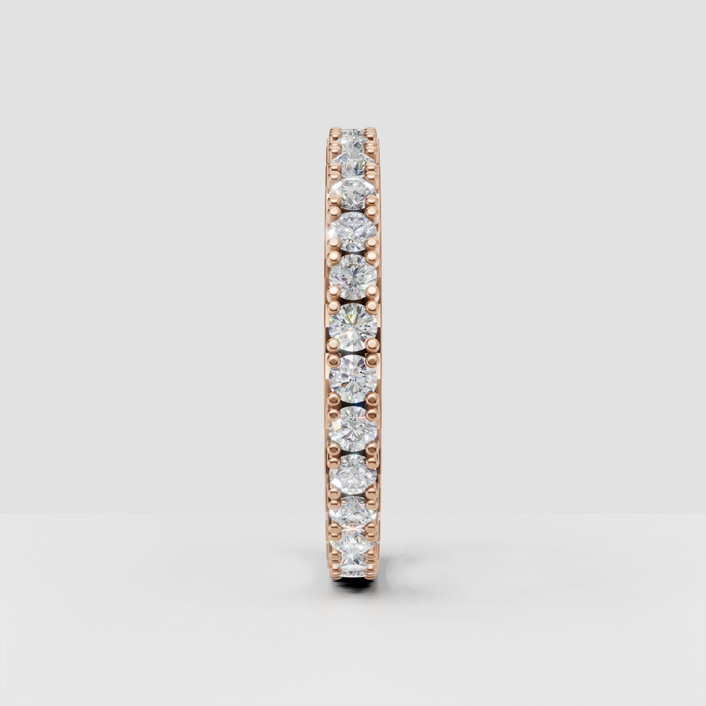 Elegant round cut diamond eternity wedding band with polished rose gold finish