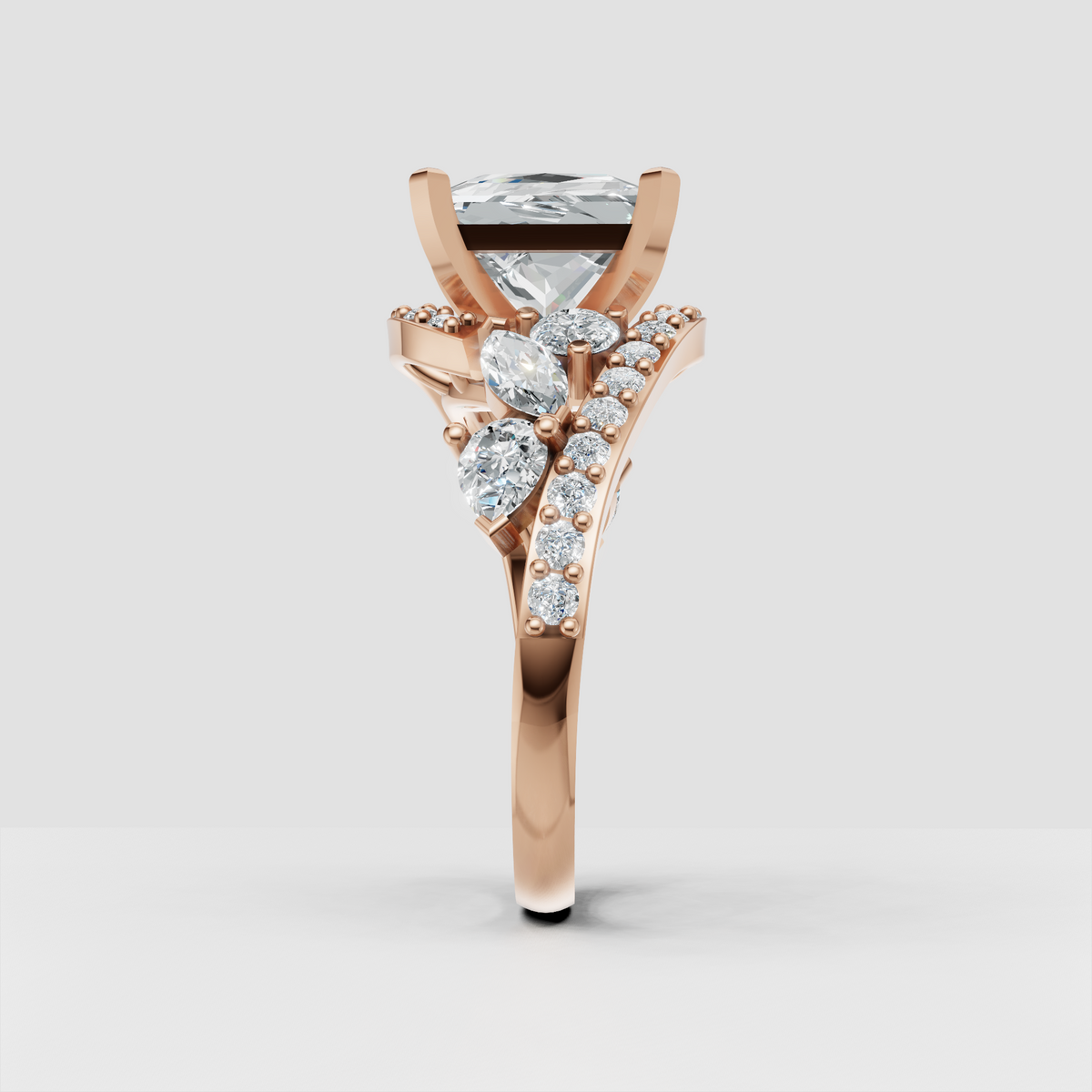 princess-cut diamond ring with pear-shaped stones along split shank