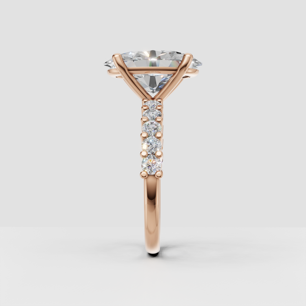 Four-prong yellow gold oval diamond ring viewed from the front