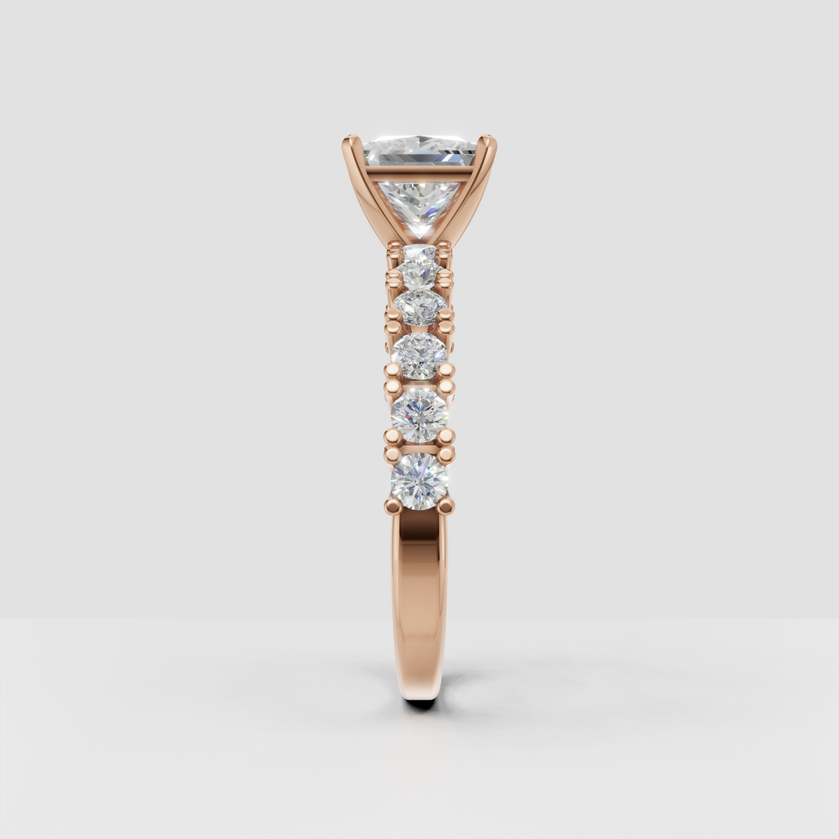 Princess cut diamond engagement ring with detailed side stone setting