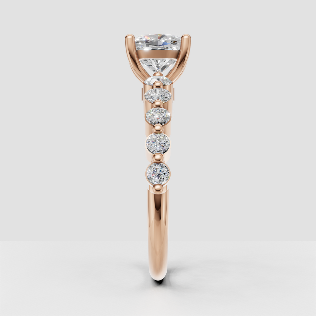 Yellow gold engagement ring with cushion center and round side stones