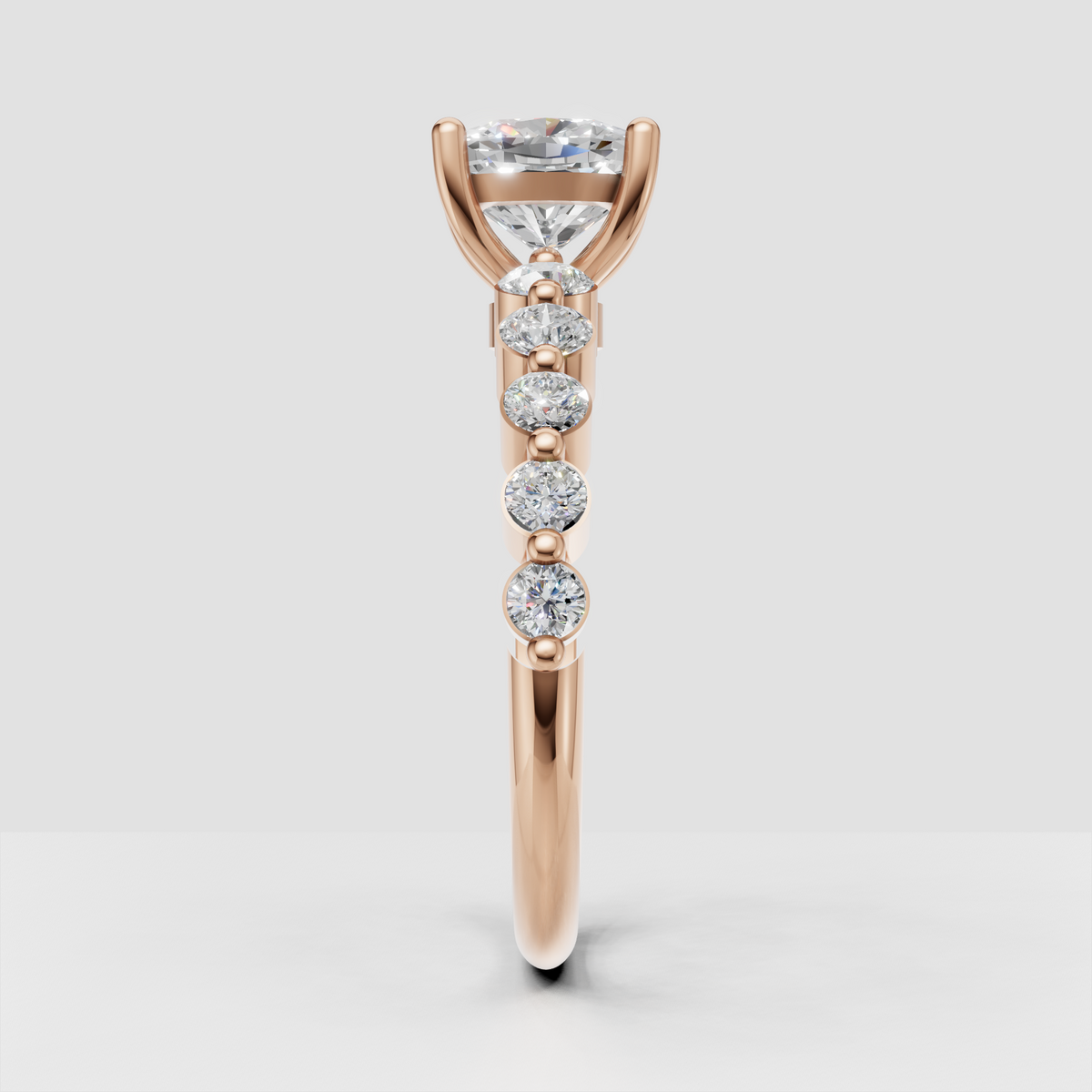Yellow gold engagement ring with cushion center and round side stones