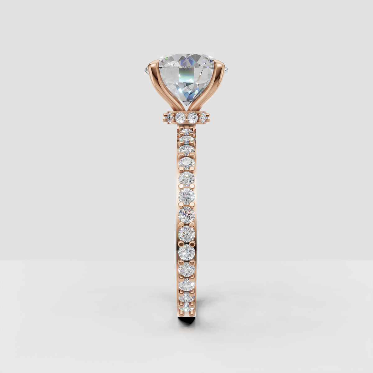 Brilliant round diamond ring with sparkling shoulder stones and gold shank