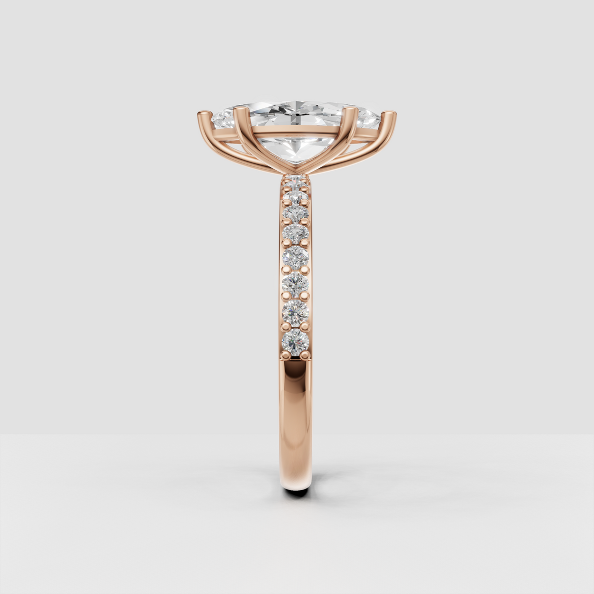 Side view of marquise diamond ring with elevated basket setting