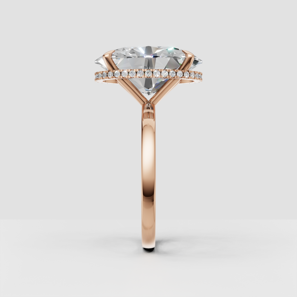 Oval center diamond with discreet halo accent stones