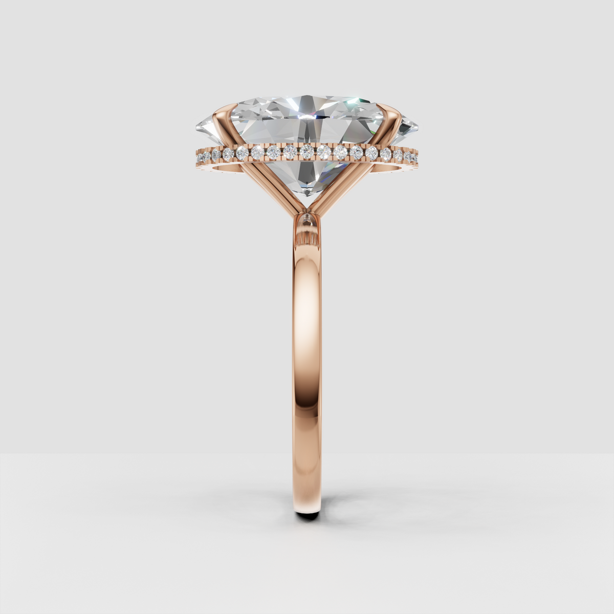 Oval center diamond with discreet halo accent stones