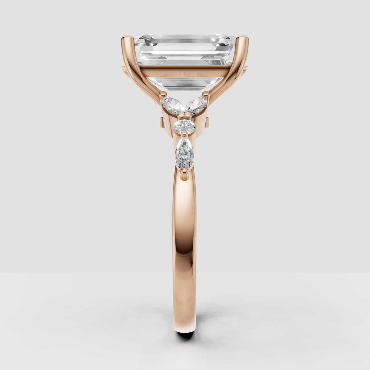 Emerald cut diamond ring with marquise side stones