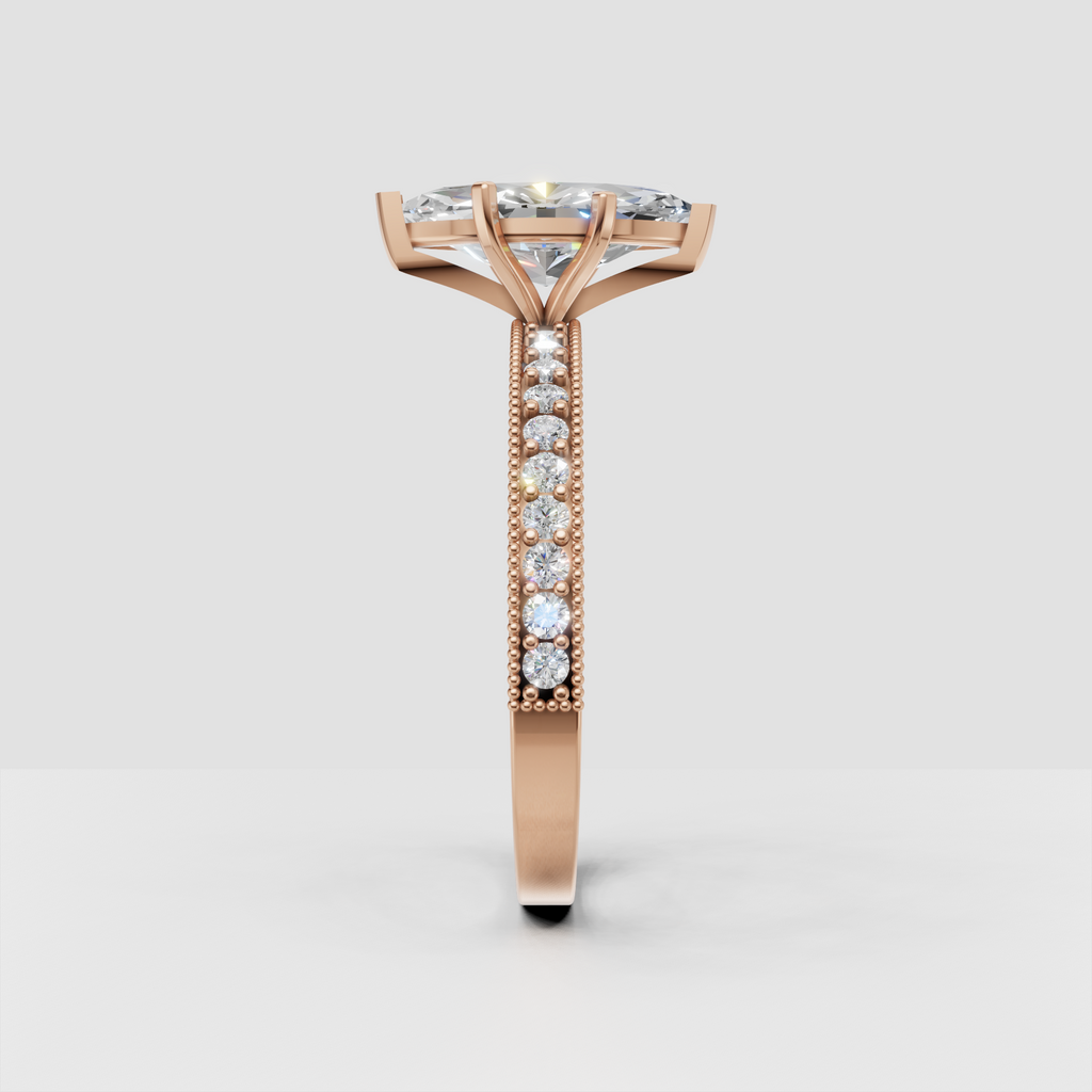 Marquise diamond ring with sparkling side stones and milgrain accents