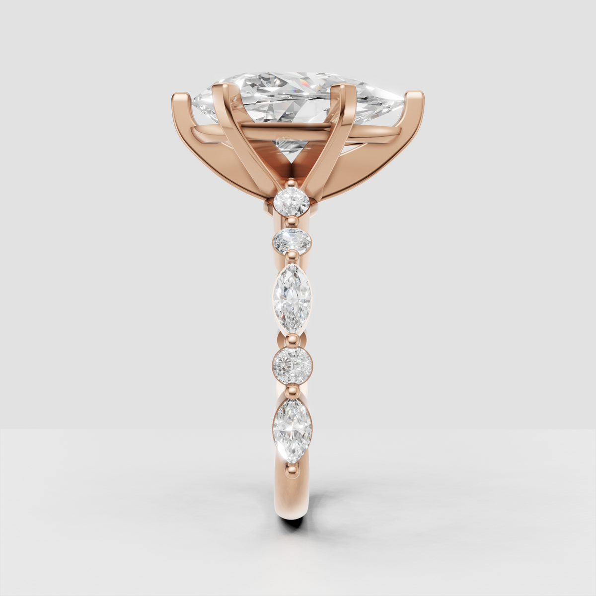 Elegant pear diamond bridal ring with distinctive flowing band