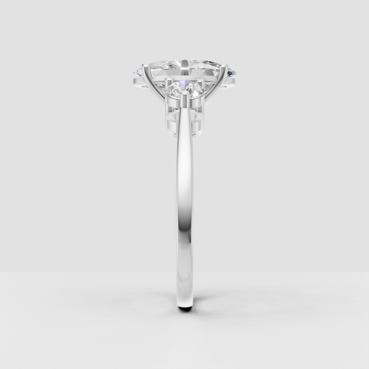 Polished gold oval diamond three stone engagement ring
