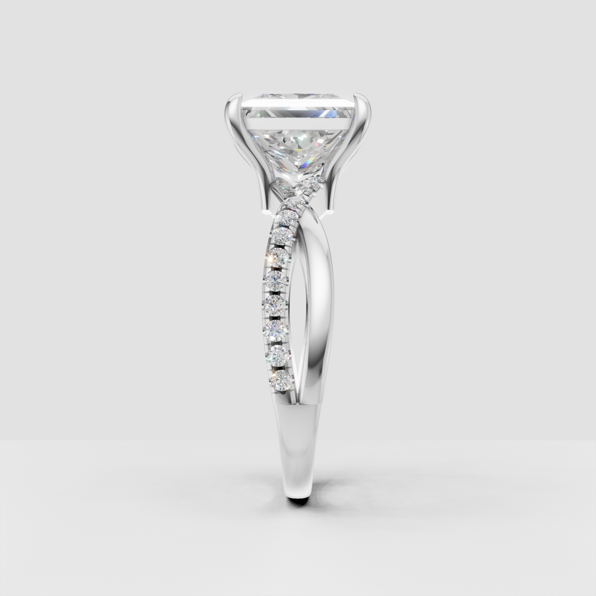 Princess diamond engagement ring featuring a polished yellow gold setting