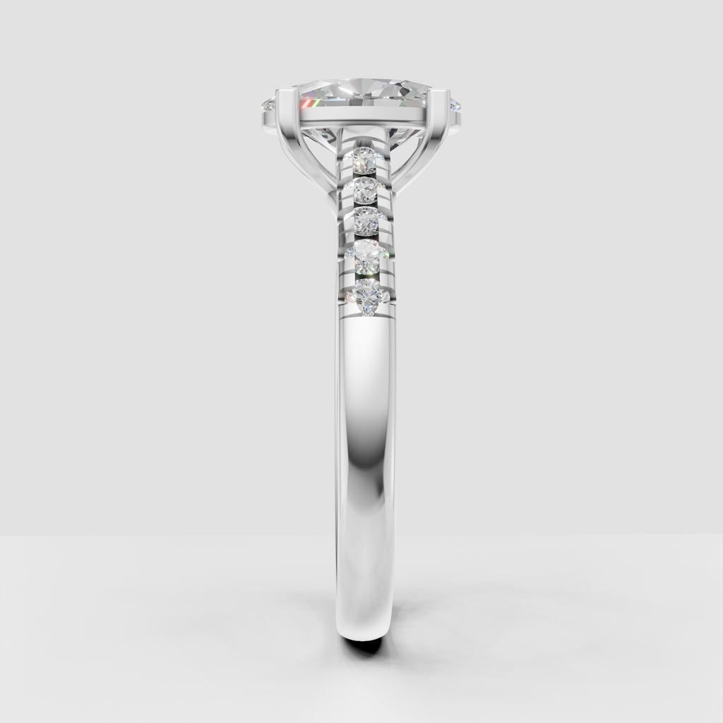 Oval diamond ring with four-prong solitaire setting and pavé band