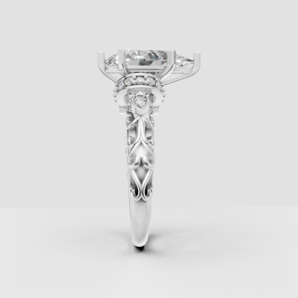 Ornate pear cut diamond engagement ring with round accent stones