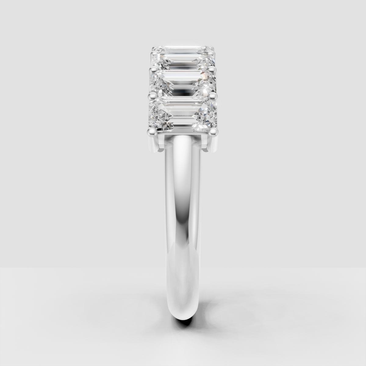 Emerald cut diamond wedding band with continuous stone setting