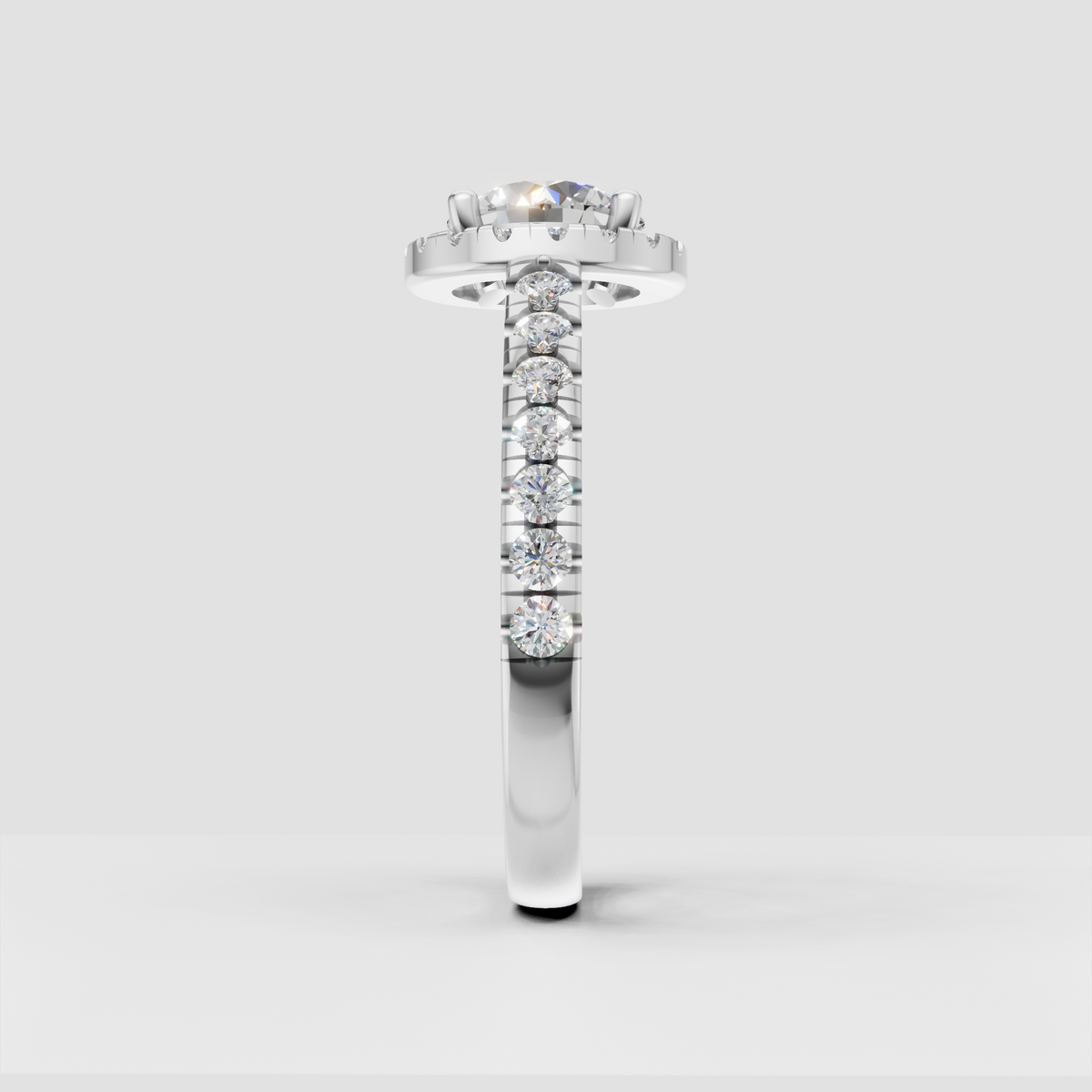 Brilliant round center stone surrounded by diamond halo