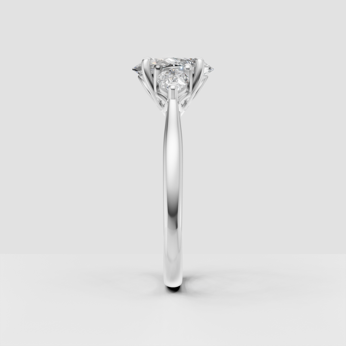 Classic oval diamond engagement ring with three-stone design