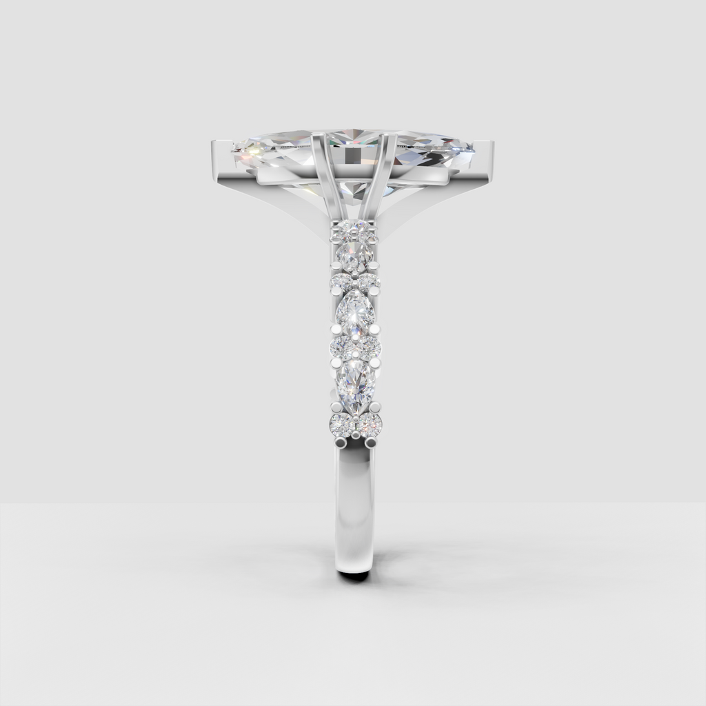 Elongated marquise diamond center stone in gold setting