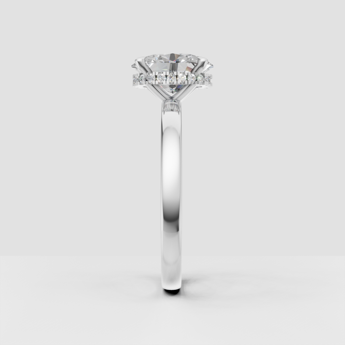 Oval diamond bridal ring with hidden halo beneath the center stone