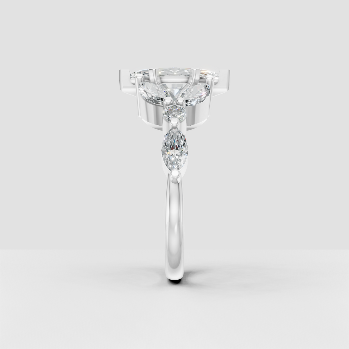 Marquise center diamond ring with elegant prong setting and side accents