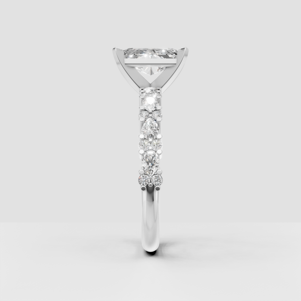 Elegant radiant cut diamond ring with diamond accented gold shoulders