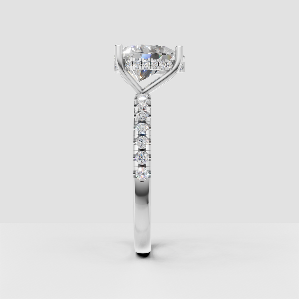 Pear cut engagement ring with diamond accented shoulders