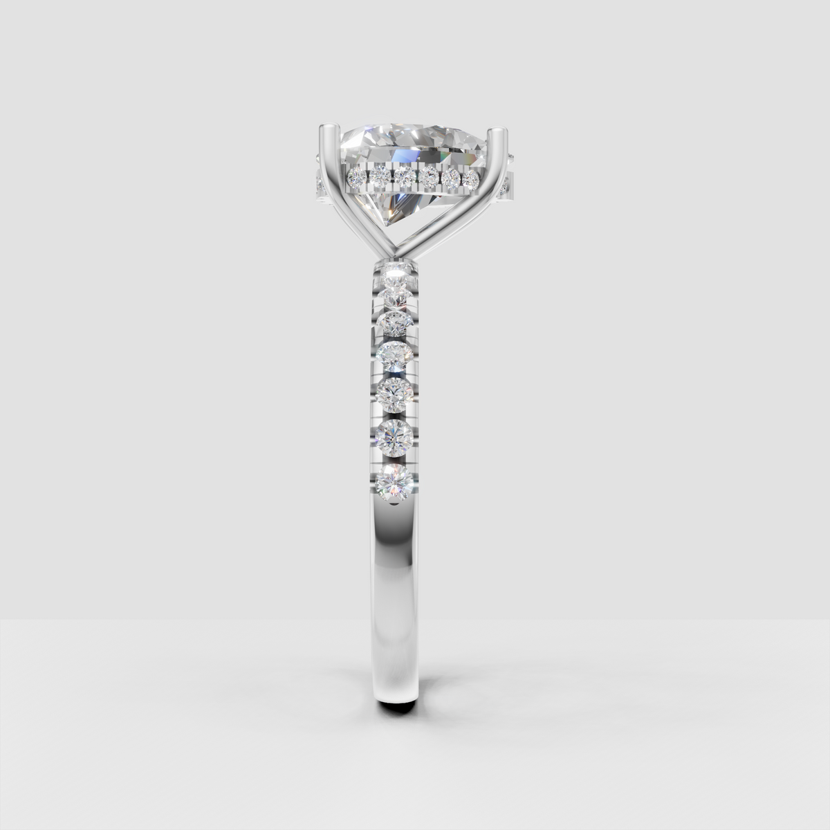 Pear cut engagement ring with diamond accented shoulders