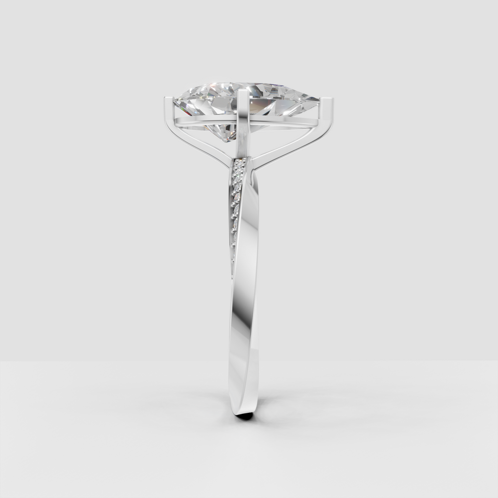 Four prong pear diamond engagement ring