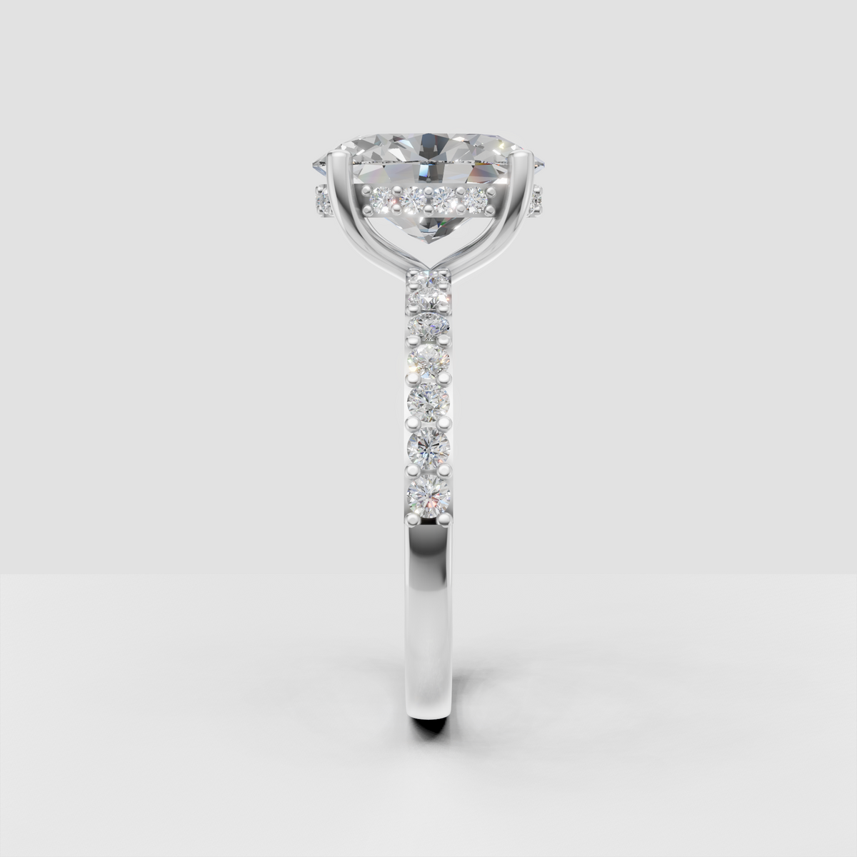 Oval center diamond engagement ring with hidden halo detail