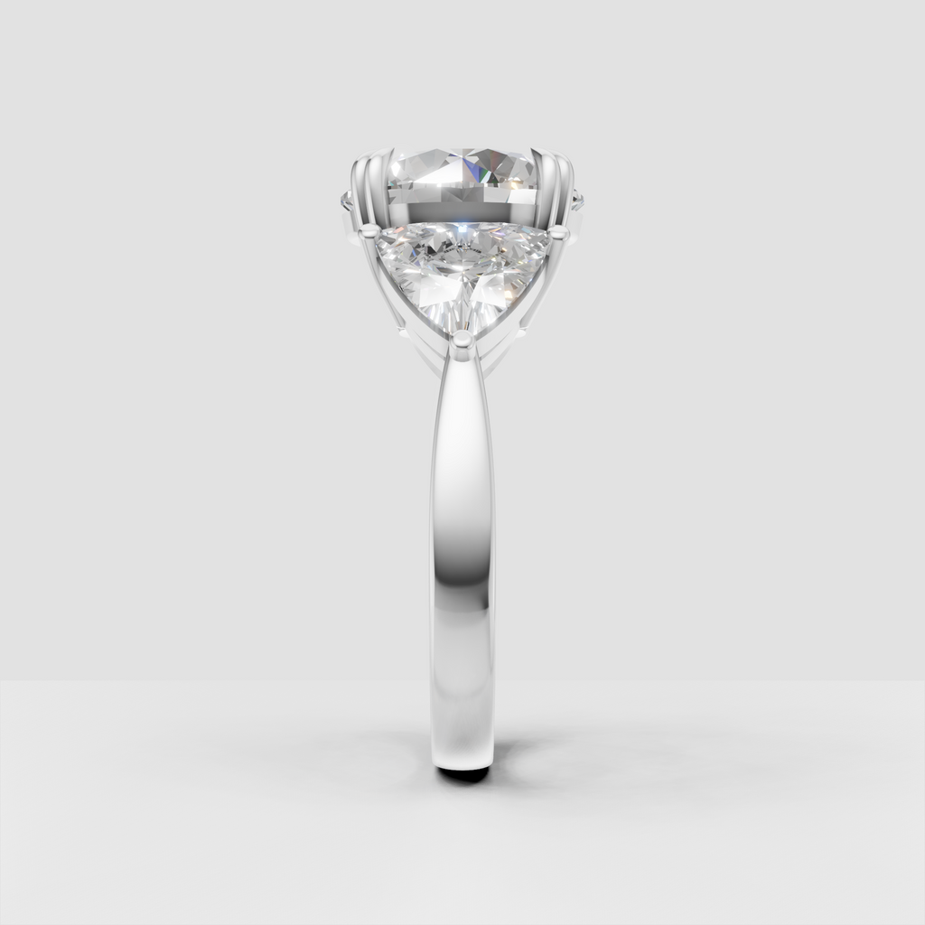 Round diamond bridal ring with three stone arrangement and decorative gold prongs