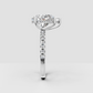 Pear diamond ring with diamond-set shoulders