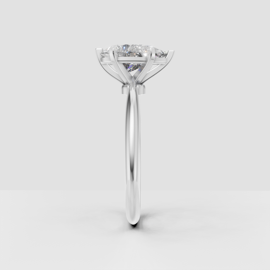 Pear-shaped center diamond secured by six rose gold prongs