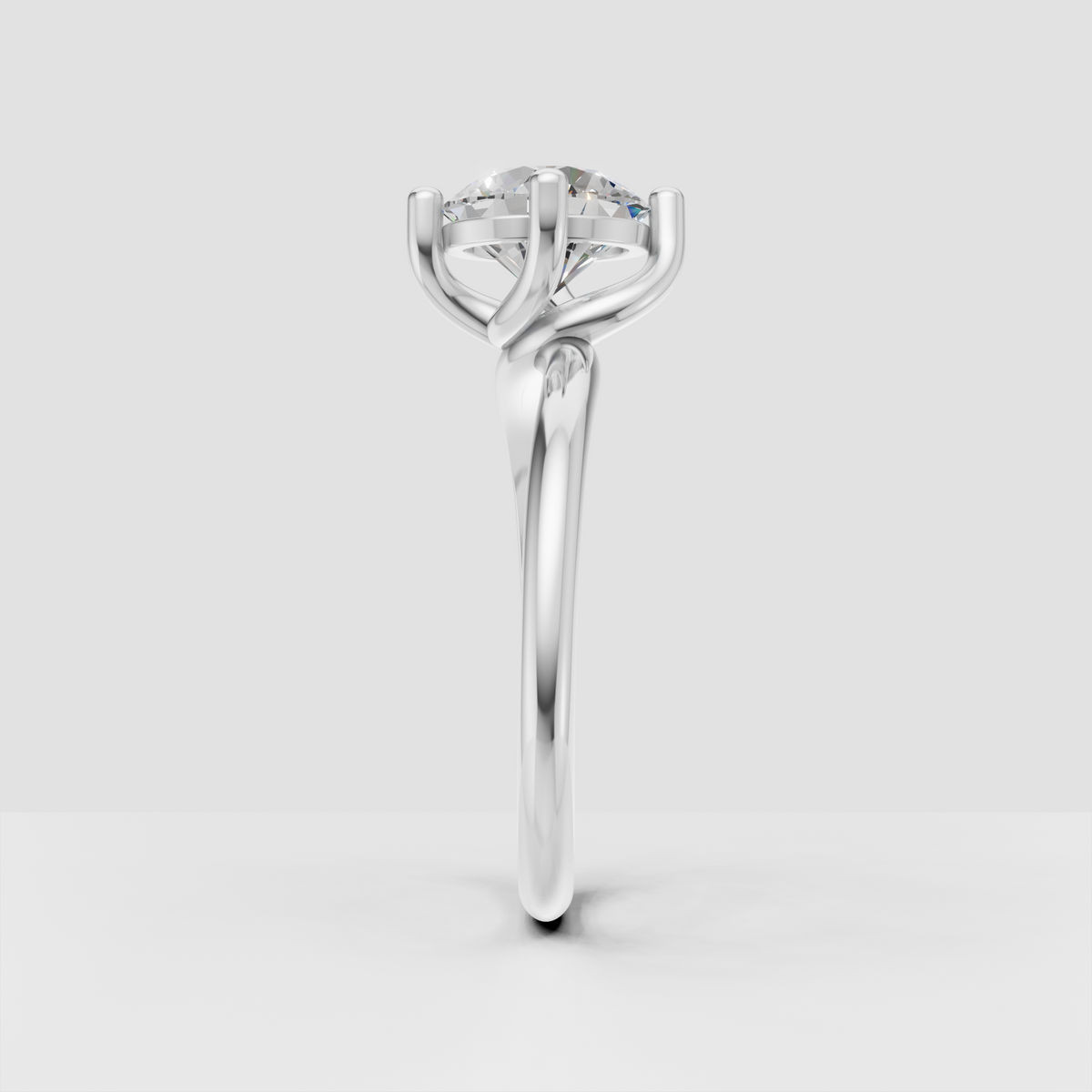 Classic round diamond solitaire ring with crossover shoulders