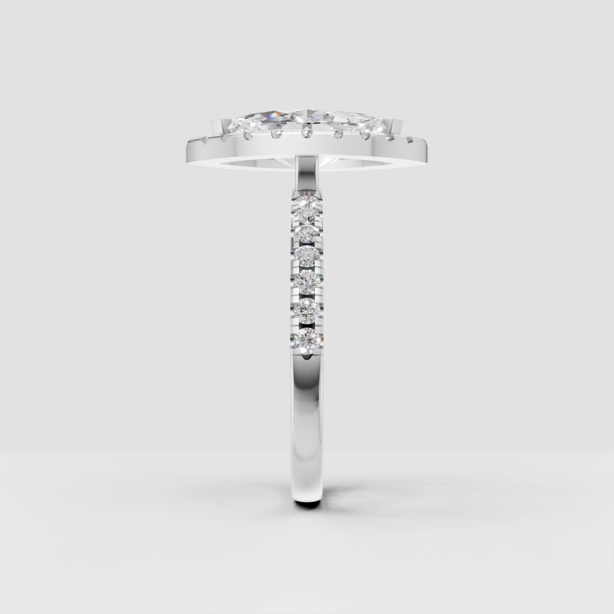 Marquise center diamond framed by a sparkling halo of round accents.