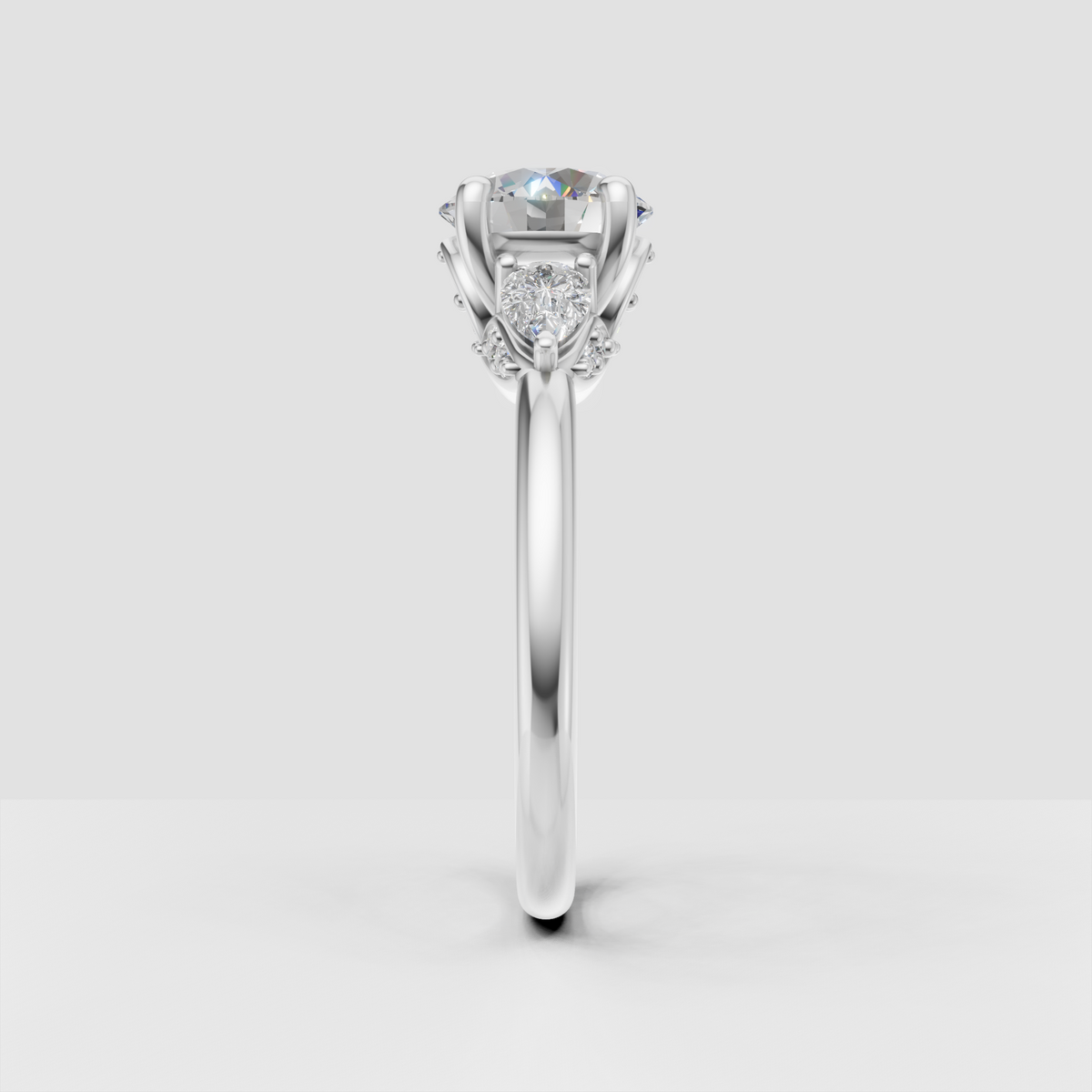 Round center diamond ring with decorative botanical side setting