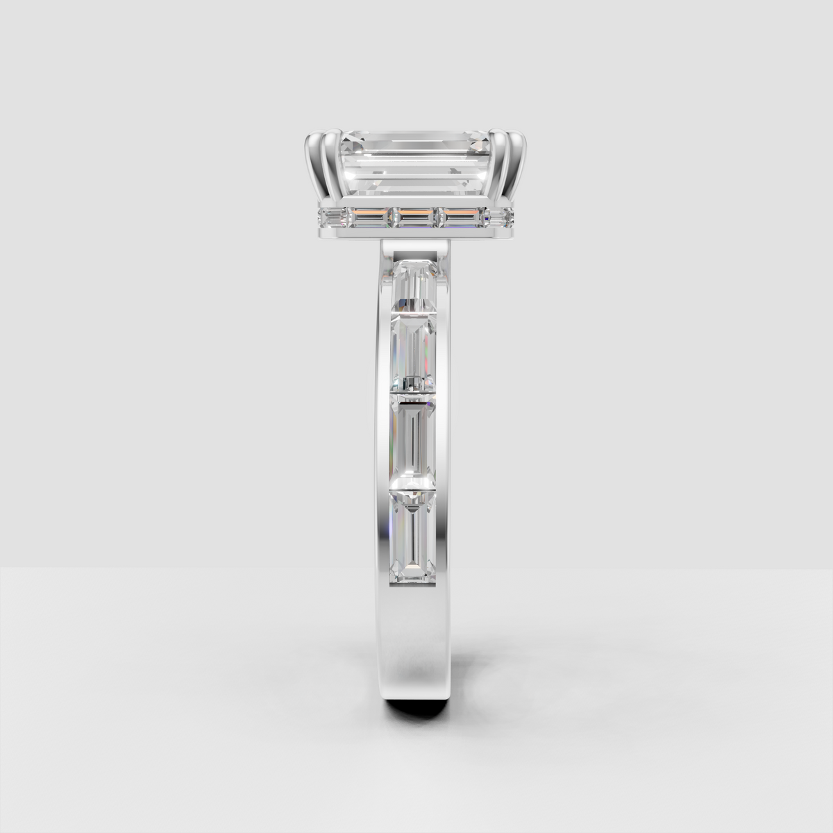 Emerald cut diamond engagement ring with channel-style baguette side stones