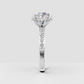 Classic round diamond solitaire ring with crossover shoulders