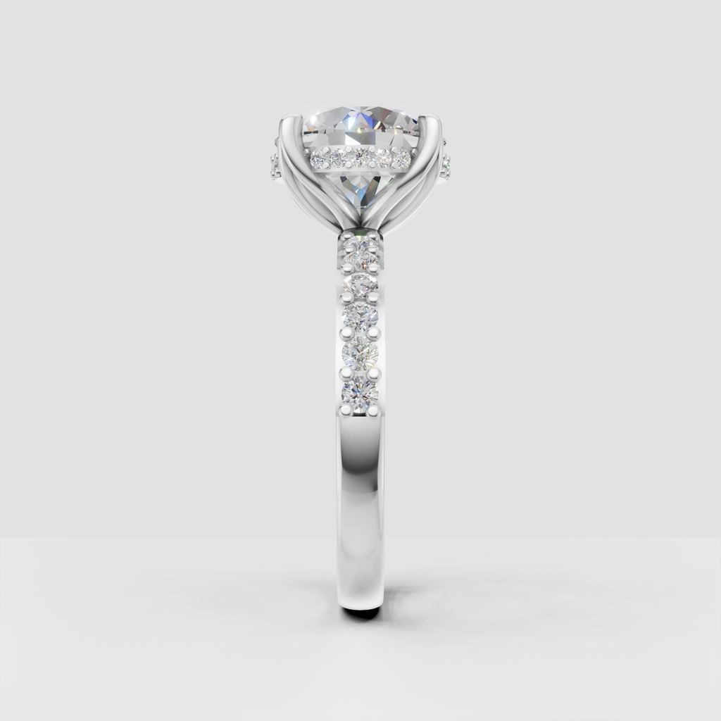 Classic round diamond solitaire ring with crossover shoulders