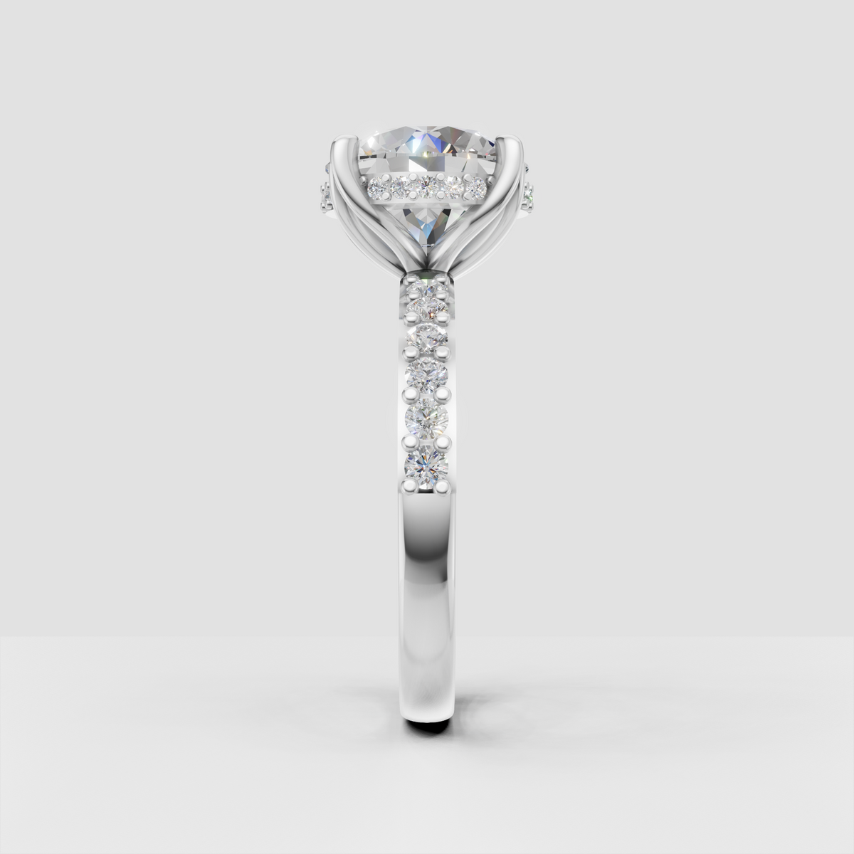 Classic round diamond solitaire ring with crossover shoulders