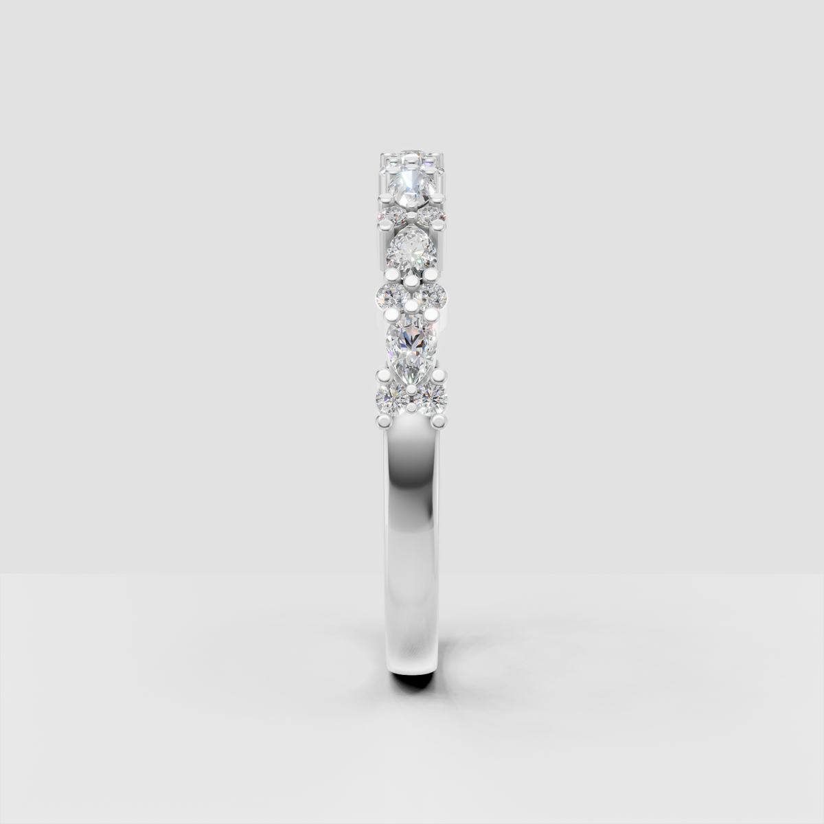 Yellow gold alternating pear and round diamond ring