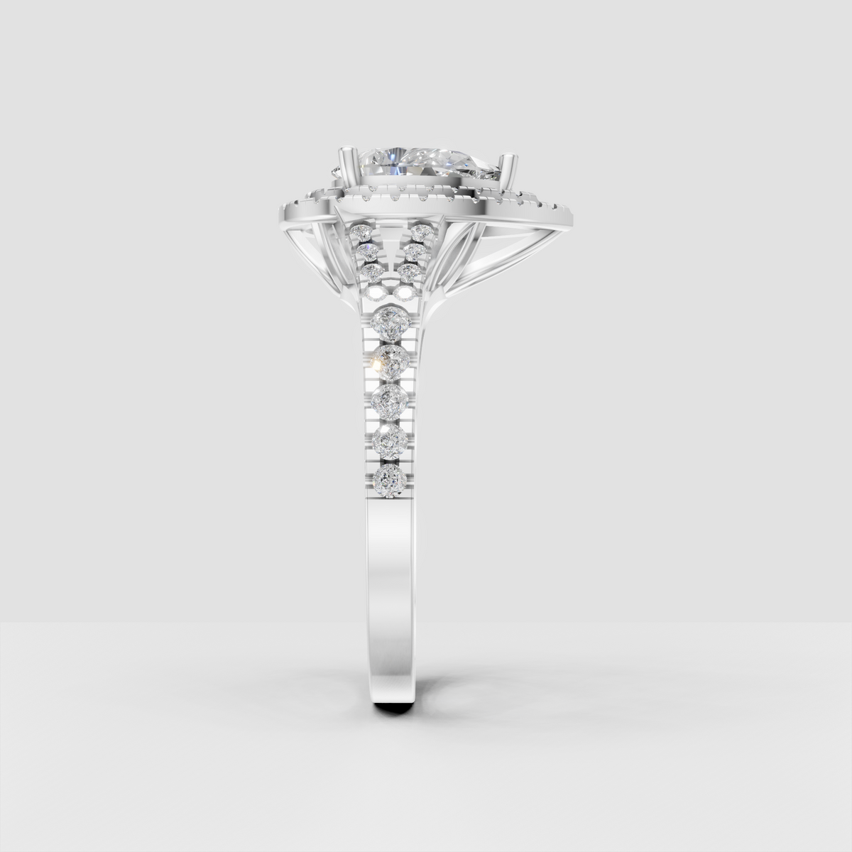 Pear Diamond double halo ring with brilliant pavé diamonds along the band