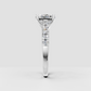 Yellow gold cushion diamond engagement ring with pavé shoulders
