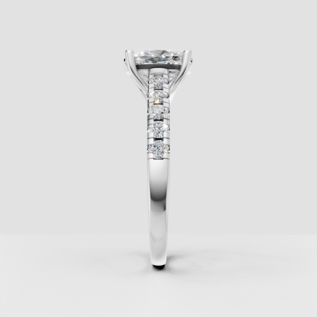 Yellow gold cushion diamond engagement ring with pavé shoulders