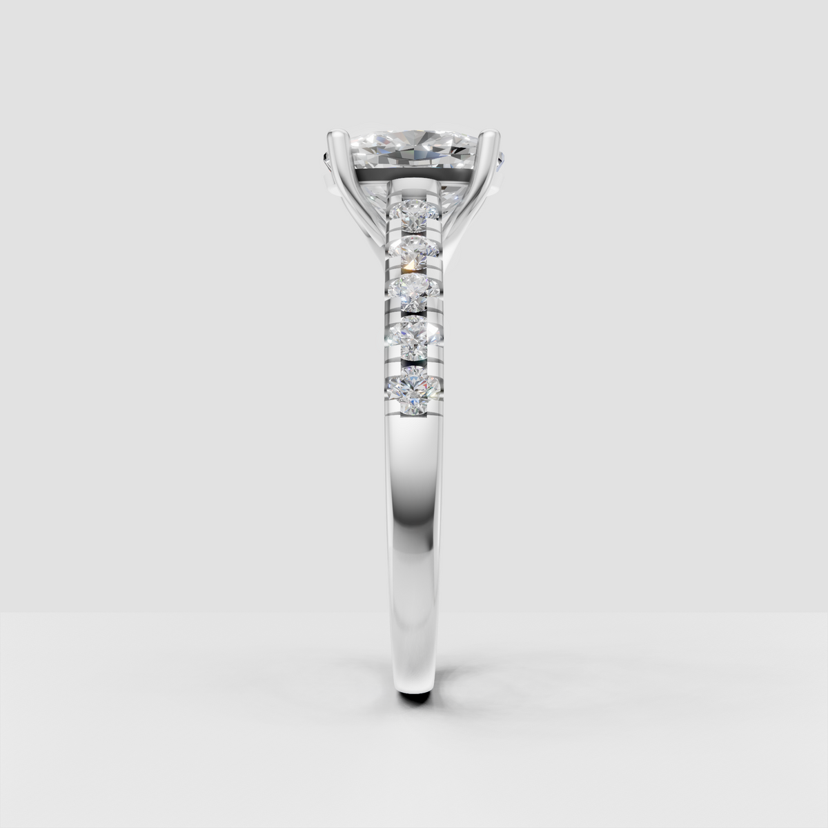 Yellow gold cushion diamond engagement ring with pavé shoulders