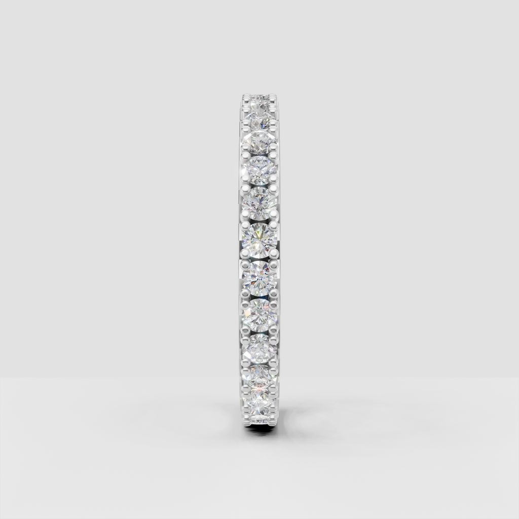 Full-circle diamond band featuring round brilliant stones and milgrain edges