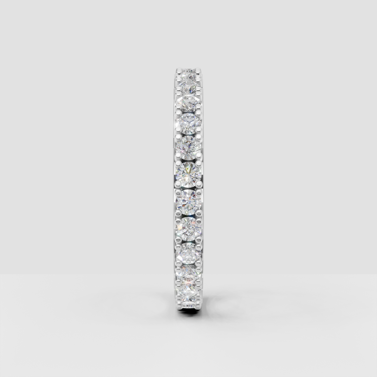 Full-circle diamond band featuring round brilliant stones and milgrain edges