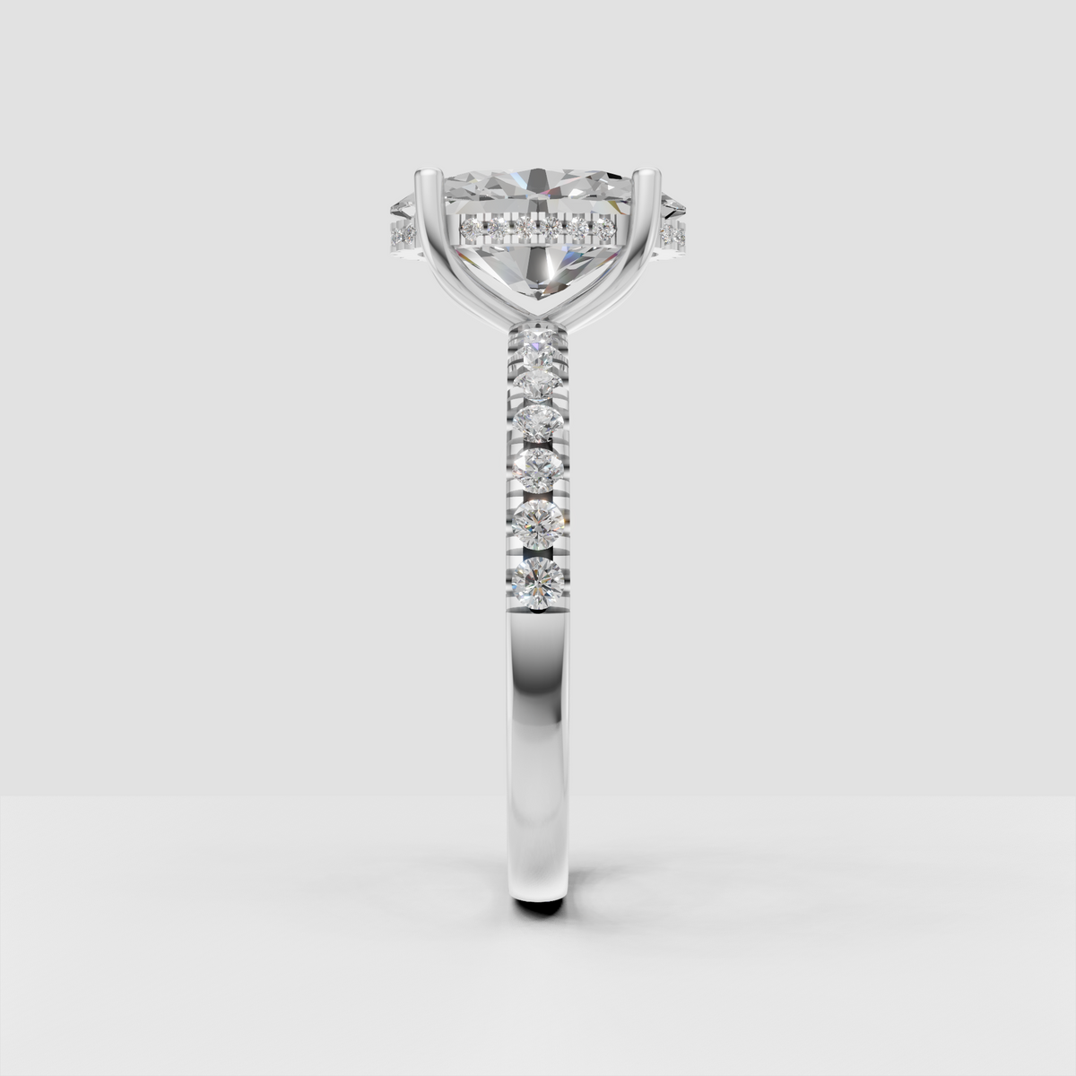 Four prong oval diamond engagement ring with hidden halo