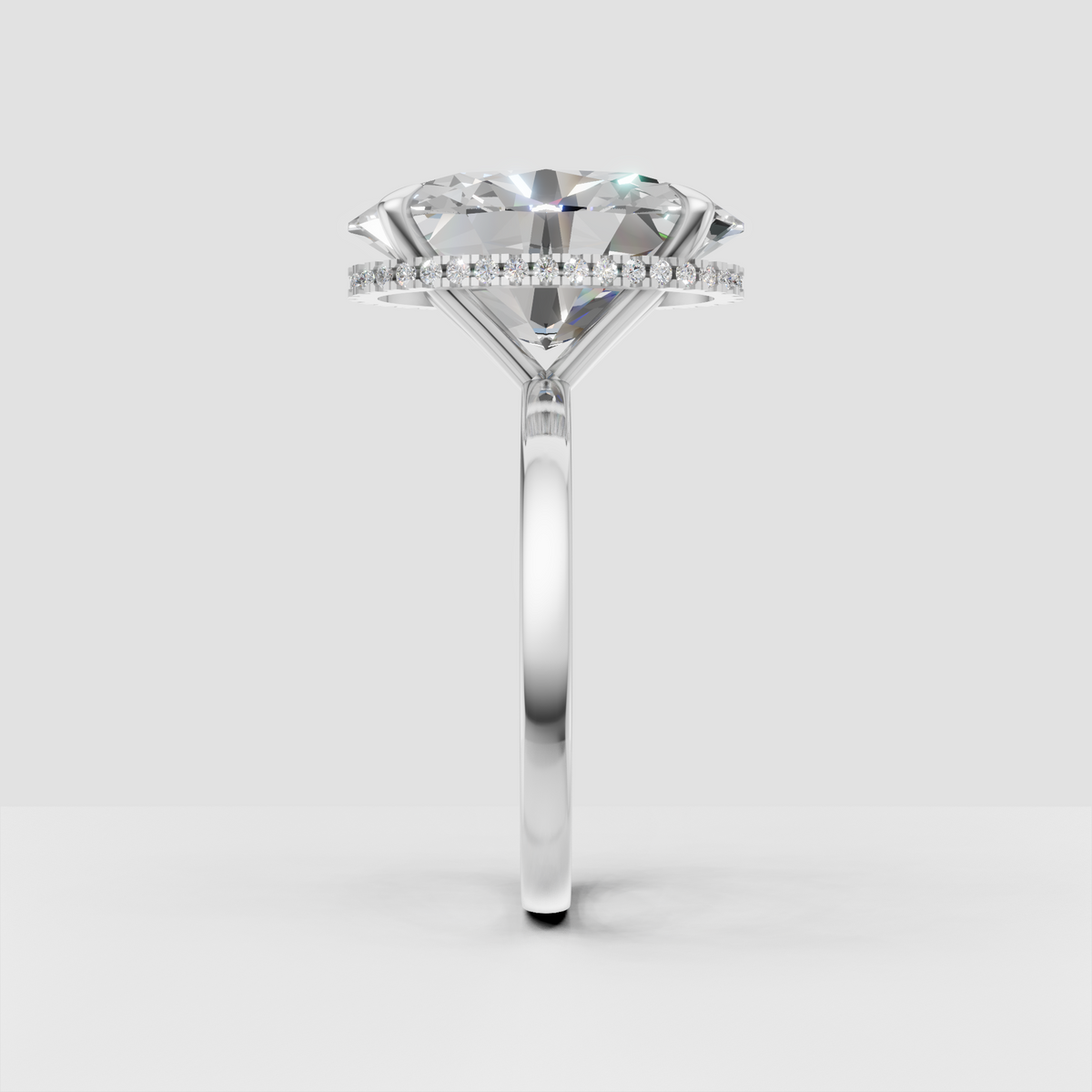 Oval cut diamond ring with concealed round diamond halo